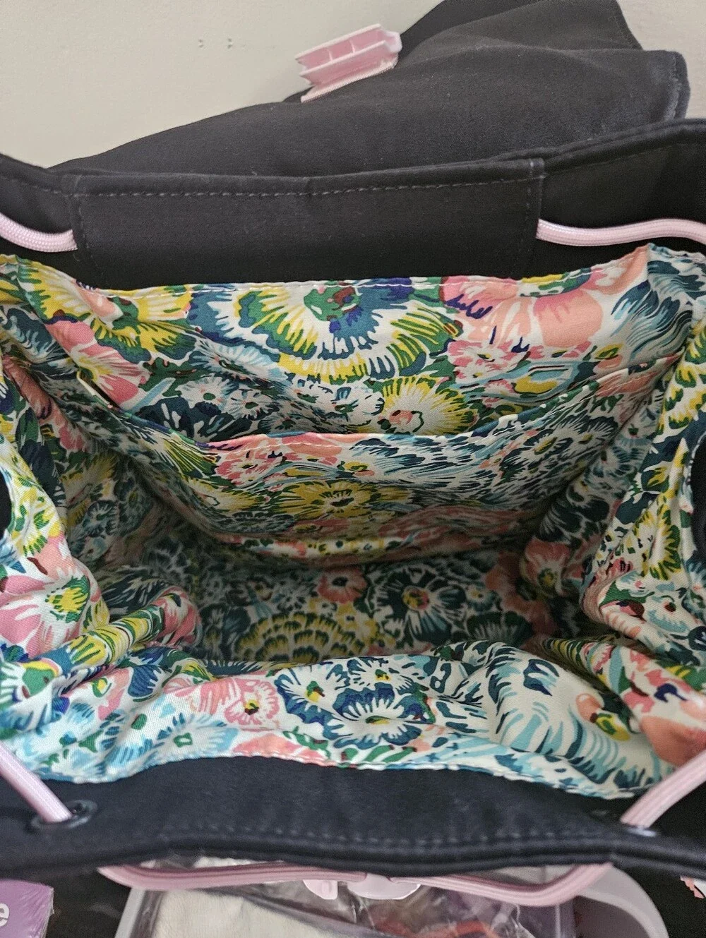 Black Drawstring Backpack with Pink Trim and Floral Lining